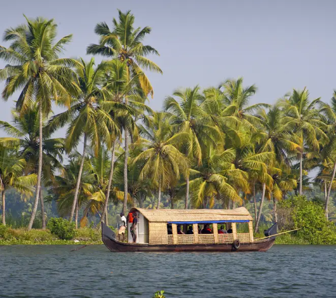 Traditional houseboat cruising through Kerala backwaters